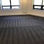 This is a photo of a grey office carpet that has just been professionally steam cleaned works carried out by Ruislip Carpet Cleaning Solutions