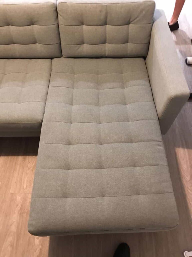 This is an after photo of a grey sofa that has been steam cleaned works carried out by Ruislip Carpet Cleaning Solutions