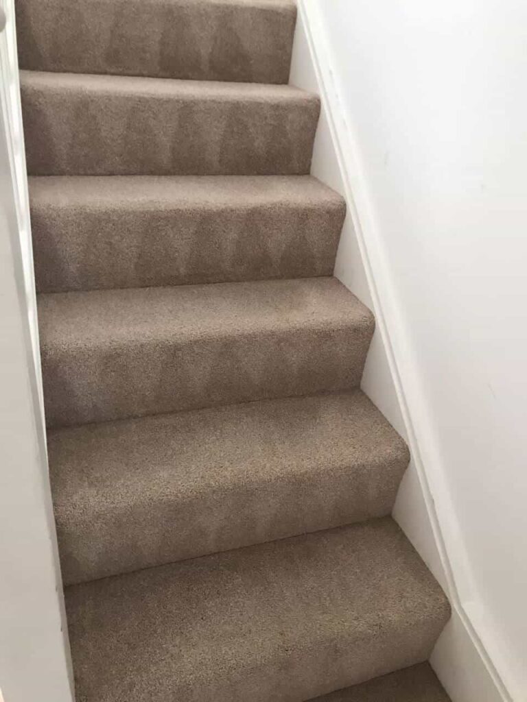 This is an after photo of a staircase with a beige carpet that has been cleaned works carried out by Ruislip Carpet Cleaning Solutions